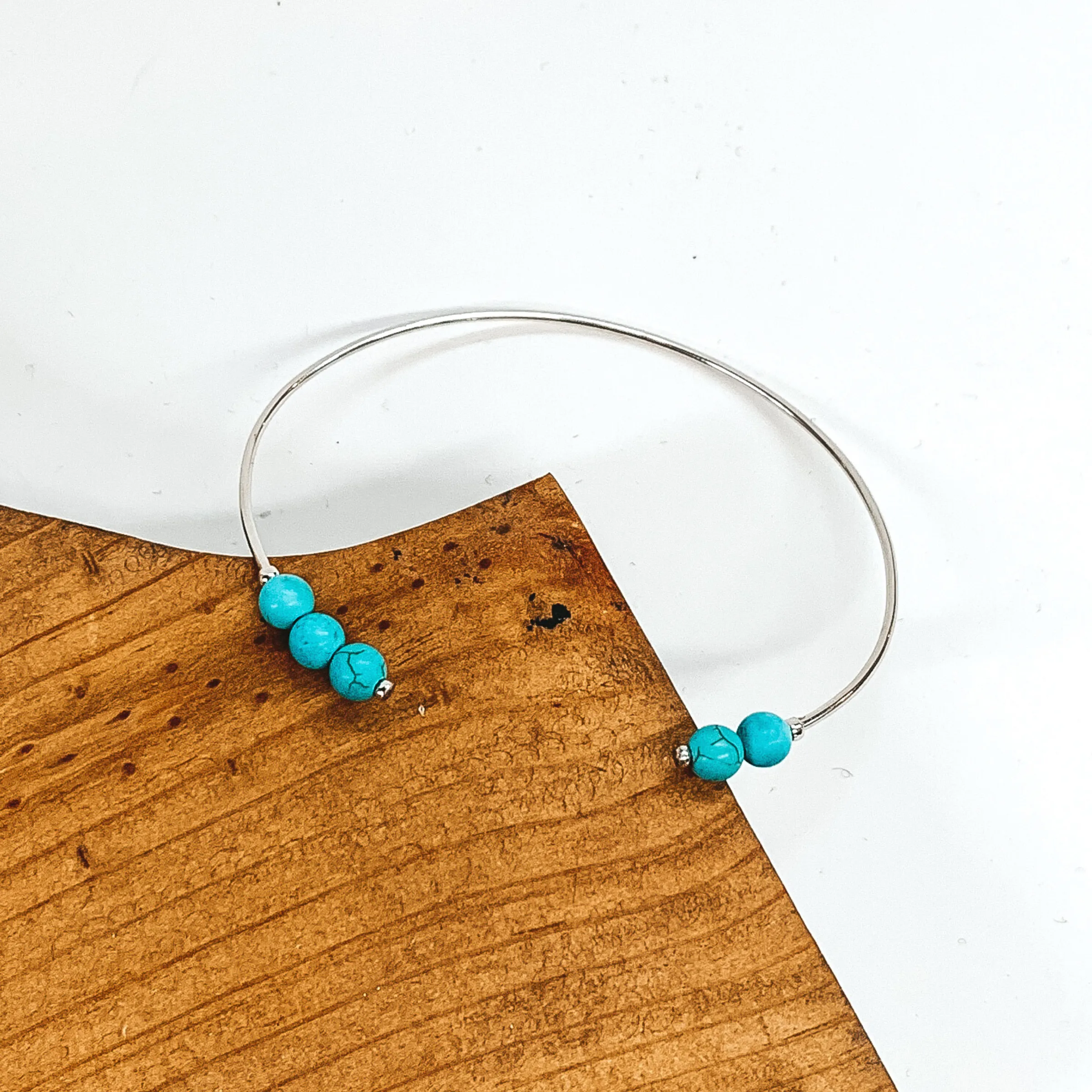 Thin Wire Bangle with Beaded Turquoise Ends in Silver Tone